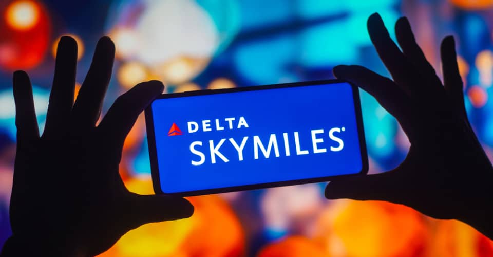 Delta SkyMiles logo on a phone screen promoting their loyalty program.